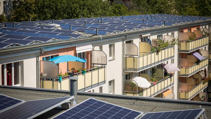 Aerial view of a Berlin apartment block built in the 1950s, with the entire roof covered by PV modules.